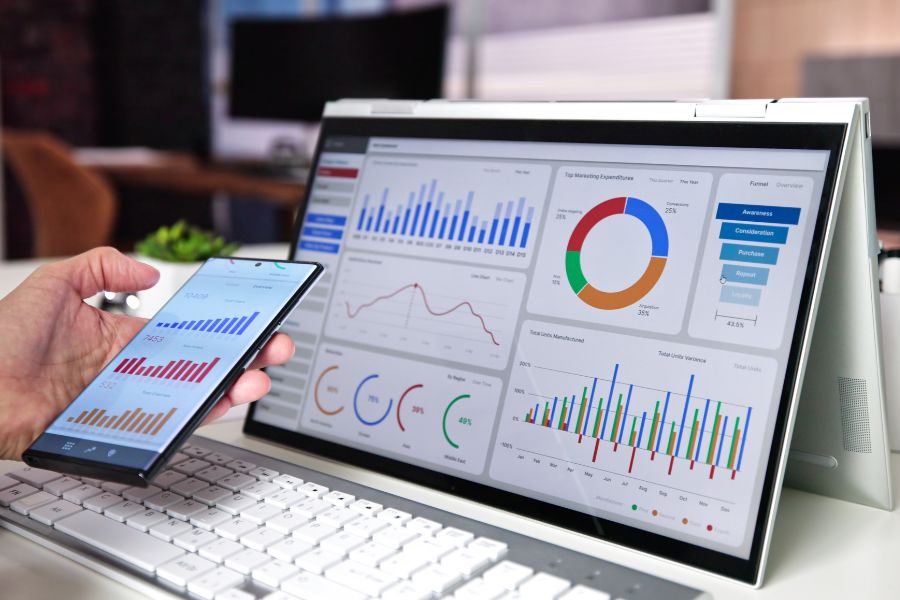 a computer and mobile phone showing various SEO metrics